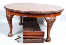 A Chippendale style mahogany 'D'end dining table with gadrooned edge on massive carved legs with