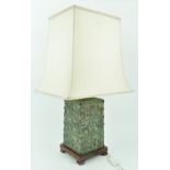 A Chinese table lamp, with silk shade above bronze patinated rectangular base,