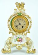 A late 19th century French porcelain cased mantel clock with count wheel strike, striking on a bell,