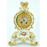 A late 19th century French porcelain cased mantel clock with count wheel strike, striking on a bell,