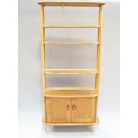 An Ercol light elm and beech room divider,