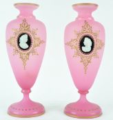 A pair of Victorian pink frosted glass vases, with gilt jewelling, each applied with a cameo,