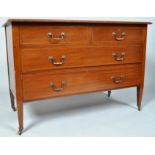 An Edwardian mahogany chest of two short and two long drawers, by Waring & Gllows,