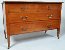 An Edwardian mahogany chest of two short and two long drawers, by Waring & Gllows,