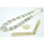 A pierced bone folding letter/paper knife a similar necklace and s brooch (3)