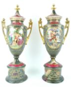 A pair of late 19th century Vienna style porcelain two handled urns and covers,