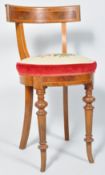 A Victorian mahogany cellists chair, with round tapestry seat on turned tapering legs,