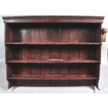 A Victorian painted pine dresser with raised plate rack above two drawers and two panelled doors on