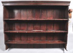 A Victorian painted pine dresser with raised plate rack above two drawers and two panelled doors on