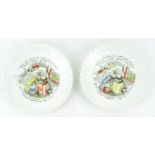 A pair of mid 19th century children's plates with moulded daisy edge and crib scenes to the centres,