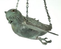 A cast alloy incense burner, in the form of a bird with outstretched wings,