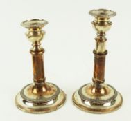 A pair of Sheffield plate telescopic candlesticks, the detachable scones with beaded borders,