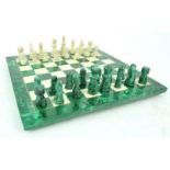 A chess board, set malachite and white stone, with similar figures,