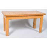 A rectangular oak coffee table, the top inlaid with box wood and ebony, on square legs,
