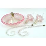 A Victorian glass epergne, the circular frilled base with pink rim,