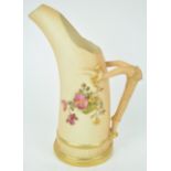 A Royal Worcester blush ivory Tusk style jug, decorated with a floral spray,