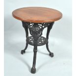 An oak and cast iron pub table,