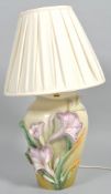 A late 20th century glazed pottery/earthenware floral lamp base,