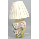 A late 20th century glazed pottery/earthenware floral lamp base,