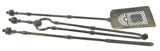 A set of three George III cast iron fire irons,