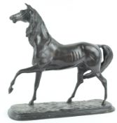 A bronze horse in naturalistic pose, holding a front leg aloft, 27.