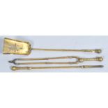 A nest of three late 19th century brass fire irons,