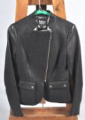 A Barbour International ladies jacket, with leather arms, cross zip and two pockets,