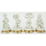 A set of four Continental bisque figures of putti depicting the Four Seasons,