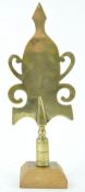 A 19th century West Country Friendly brass stave head, Butleigh, on later oak plinth,