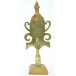 A 19th century West Country Friendly brass stave head, Butleigh, on later oak plinth,