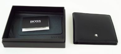 A new and unused Mont Blanc black leather wallet with two note sections and eight credit card slots