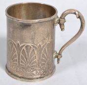 A silver mug of plain cylindrical tapering form,