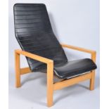 A 1970s retro vintage easy lounge chair/armchair having a ribbed vinyl upholstered seat and back