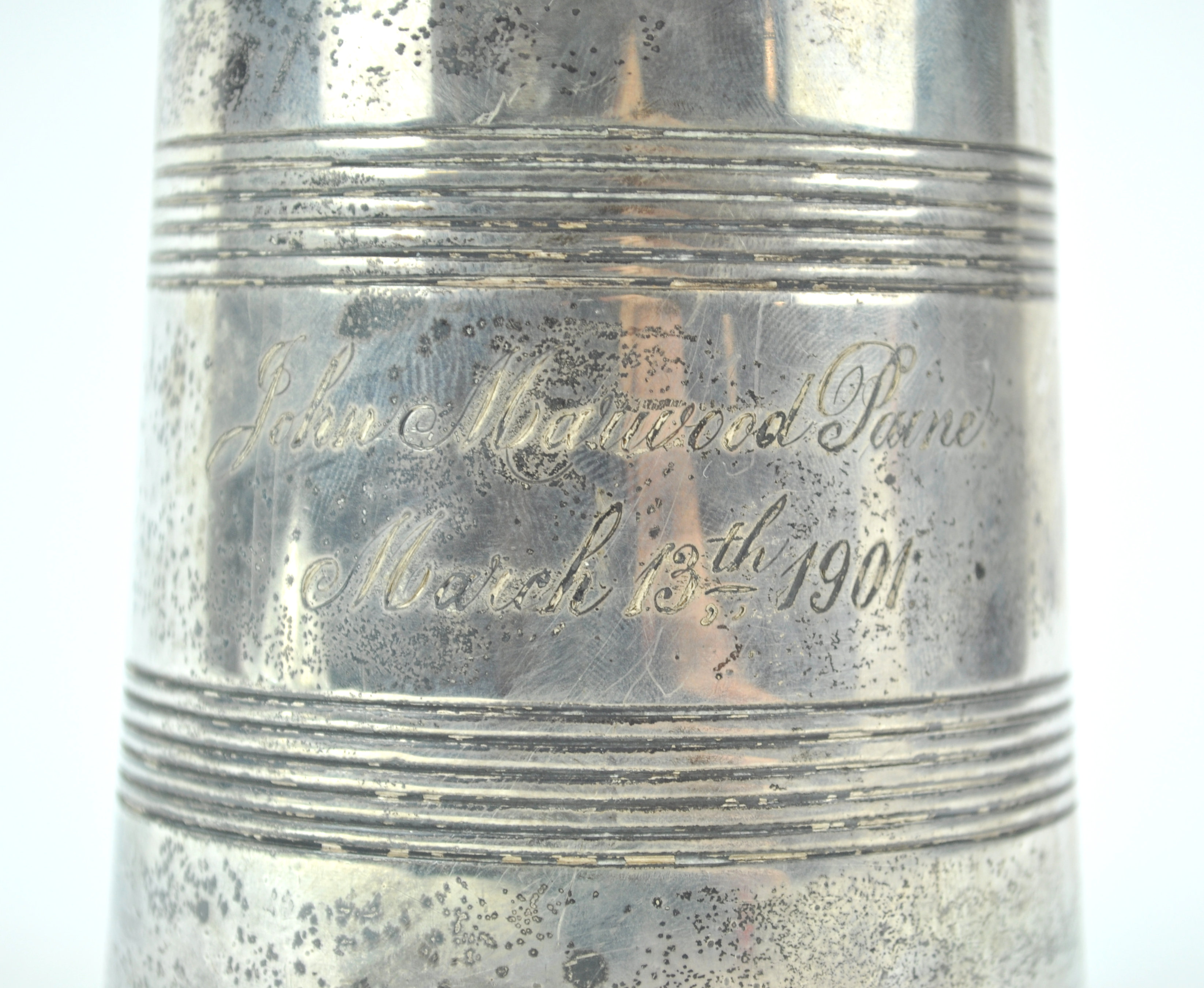 A silver mug, of tapering cylindrical form, with two bands of line engraving and a shaped handle, - Image 2 of 3