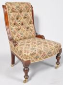 A Victorian nursing chair with upholstered back,