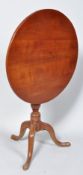 A George III pad foot mahogany tilt top tripod table,