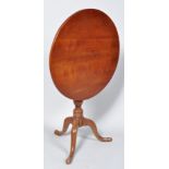 A George III pad foot mahogany tilt top tripod table,