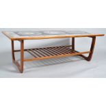 A G-plan tiled coffee table, circa 1960-70, of rectangular form, the top inlaid with black,