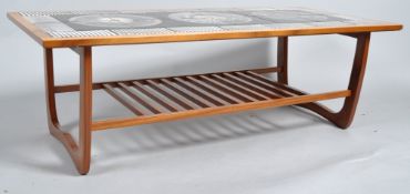 A G-plan tiled coffee table, circa 1960-70, of rectangular form, the top inlaid with black,