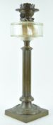 A Victorian brass oil lamp with clear cut glass reservoir on a reeded column with square base,