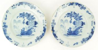 A pair of 18th century Dutch Delft plates, 1760-80, painted in blue with flowers, 22.