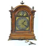 A walnut and gilt metal mounted bracket clock, the eight day movement striking on a gong,