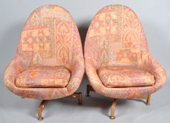 Greaves and Thomas - A pair of 1970's retro vintage revolving egg chairs/armchairs,