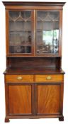A 19th century mahogany bookcase with two astragal glazed doors enclosing three adjustable shelves,
