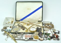 A large collection of jewellery to include: A yellow metal chain having enamelled links and shield