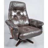 Gote Mobler - A 1960's / 70's Swedish retro vintage swivel easy lounge chair / armchair having a