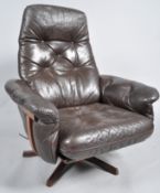Gote Mobler - A 1960's / 70's Swedish retro vintage swivel easy lounge chair / armchair having a