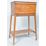 A 20th century cedar wood sewing table, the top opening to reveal four sections,