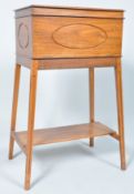 A 20th century cedar wood sewing table, the top opening to reveal four sections,