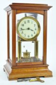 A Gustav Becker Anniversary clock with 7cm enamel dial, in glazed mahogany case,